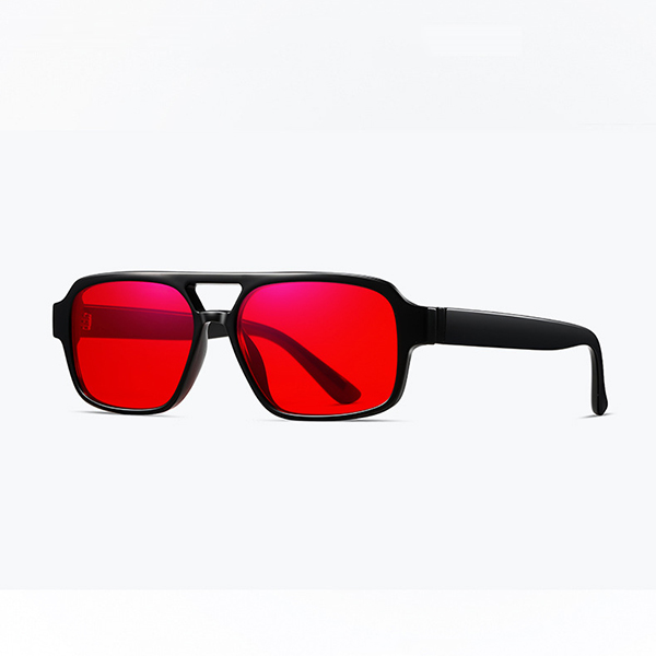 Red coated PC lenses blocking blue light from a screen