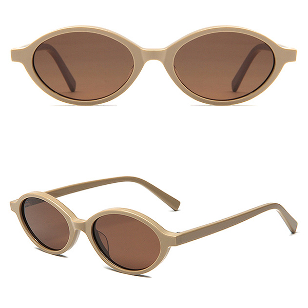 A person wearing the elliptical sunglasses, showing their understated and chic appeal