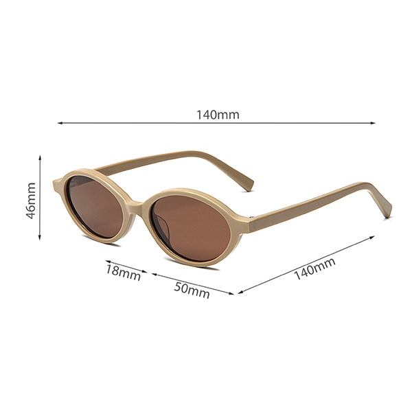 A stylish individual in an urban setting wearing the elliptical sunglasses