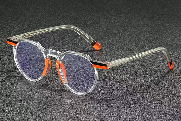 A factory worker using a checklist on a clipboard to inspect sunglasses on a production line