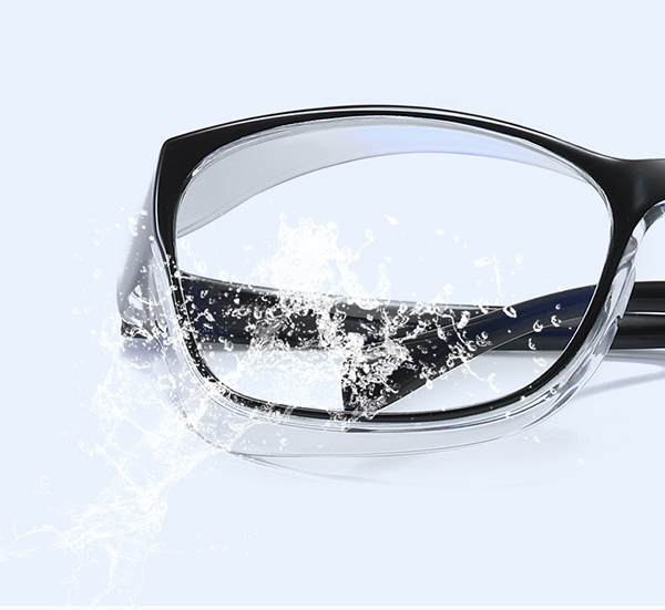 An image depicting a split scene with half day driving and half night driving, with the glasses looking clear in both