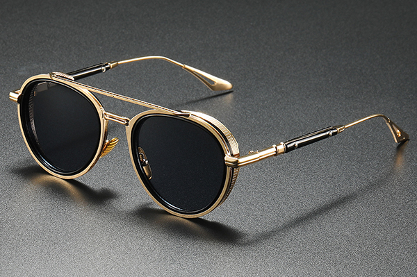 A pair of sunglasses undergoing a quality inspection for ANSI Z80.3 compliance