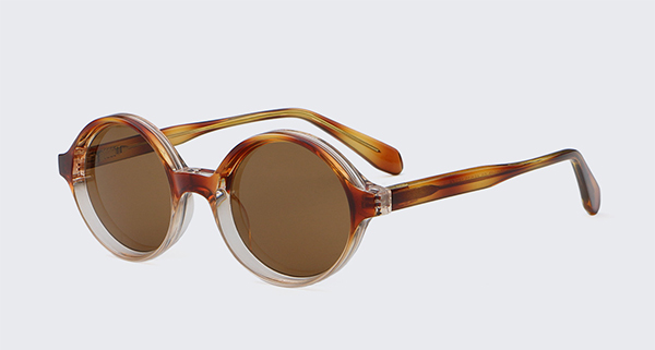 A view through different colored sunglass lenses showing the change in scenery.