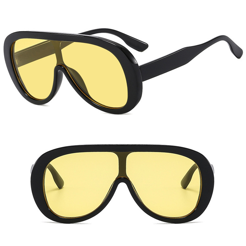Woman wearing wide-coverage sunglasses at an event