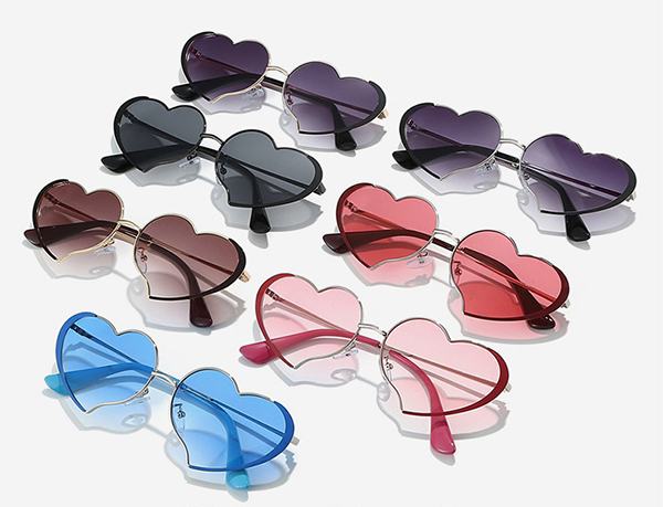 a warehouse employee packing boxes of sunglasses for shipment