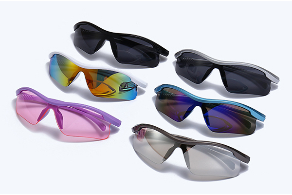 a quality control inspector examining a pair of sunglasses with a magnifying glass