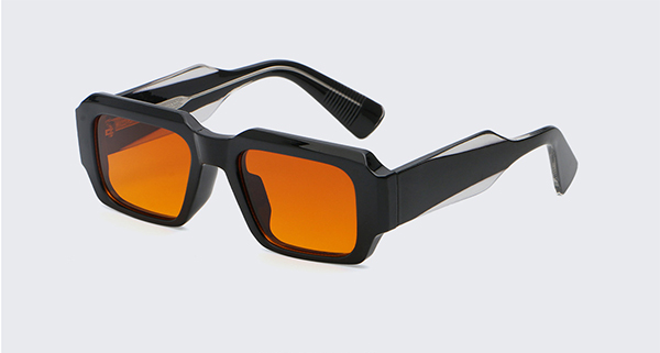 A person wearing stylish sunglasses looking confidently at the camera.