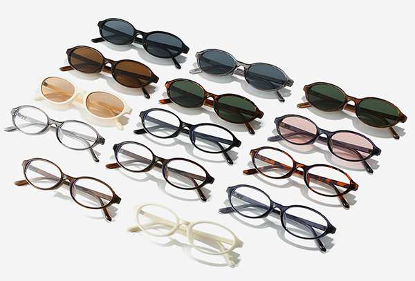 a busy trade show floor with many booths for eyewear brands