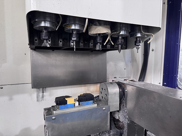 A robotic arm assembling an eyeglass frame in a smart factory.