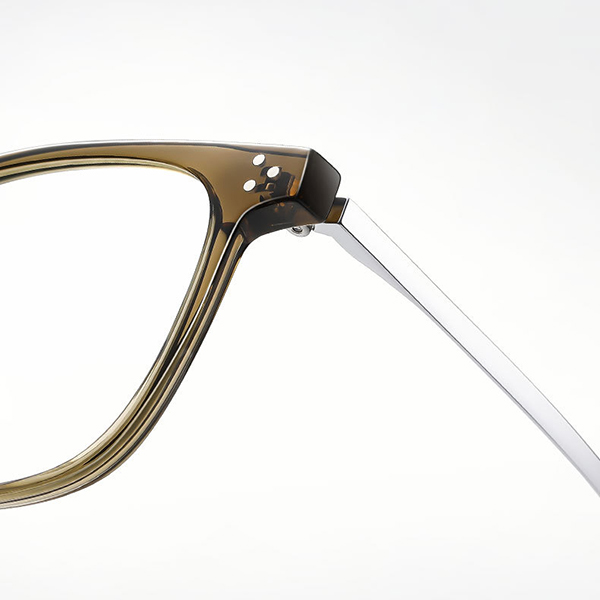 A hand bending the flexible titanium temple of the glasses