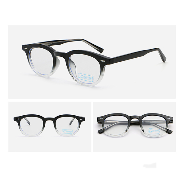 A person wearing the sleek, minimalist round glasses in a professional setting.
