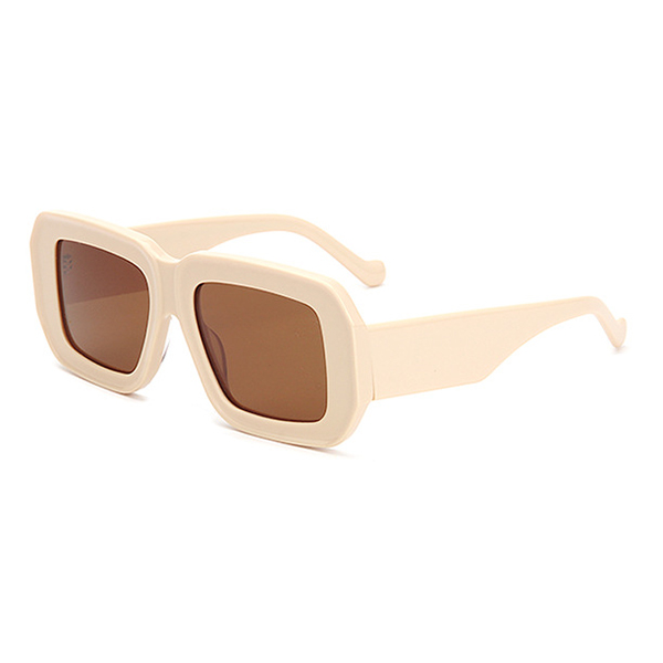 Model wearing oversized square sunglasses looking fashionable