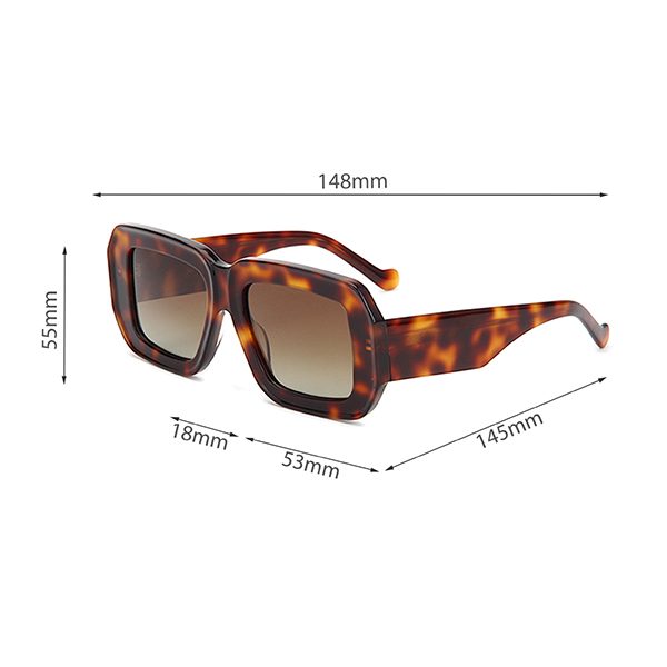 Man and woman wearing the same style of oversized square sunglasses