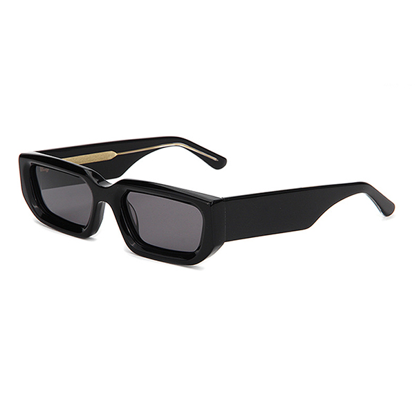 Punk fashion small frame sunglasses on a model for a street snap.