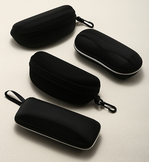 A collection of sunglasses cases in different materials and styles
