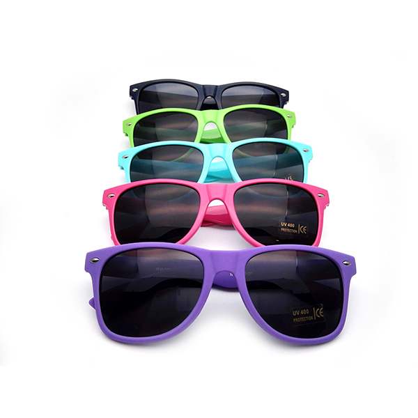 A Pantone color chart next to colorful sunglasses frames